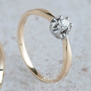 Bicolor gouden Solitairring met Diamant 0,10 karaat